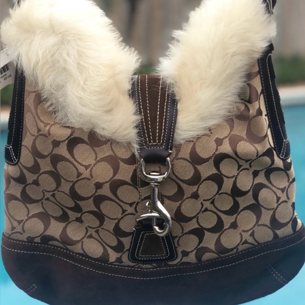 Gently used like new coach shoulder bag with fur trim.